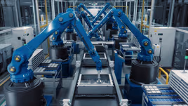 Robots moving parts in a manufacturing facility to increase automation